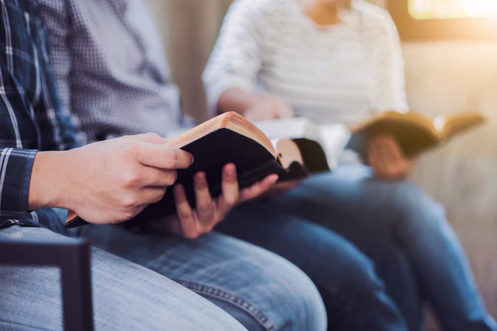 Church members reading their scriptures